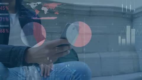 Seated man tapping smartphone while analyzing animated finance charts and world map overlay