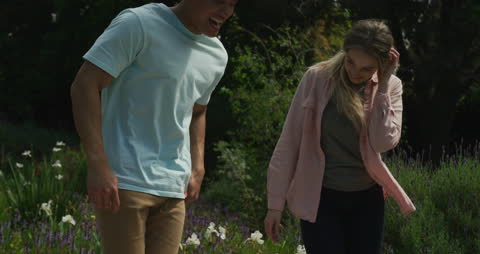 Joyful Couple Enjoying Together in Lush Garden