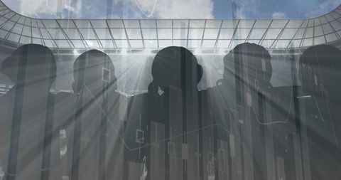 Fan Silhouettes with Digital Charts at Stadium