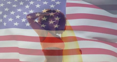 Joyful Woman with Surfboard Overlaid by American Flag