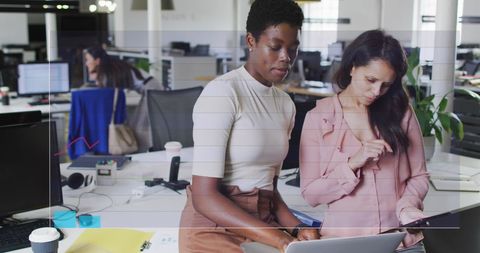 Diverse Women Collaborating on Business Data in Office - Download Free Stock Images Pikwizard.com