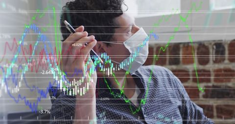 Businessman Analyzing Financial Data with Mask during Pandemic