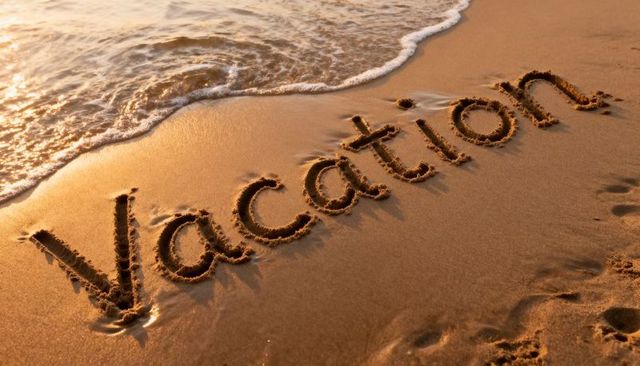 Vacation carved in sand at golden hour with wave lapping shore and footprints