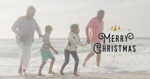 Family Strolling Beach with Merry Christmas Graphic in Warm Light