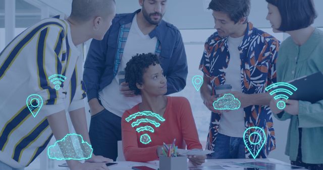 Image of digital cloud and wifi icons over diverse business people in office. Global business, connections, digital interface, computing and data processing concept digitally generated image.