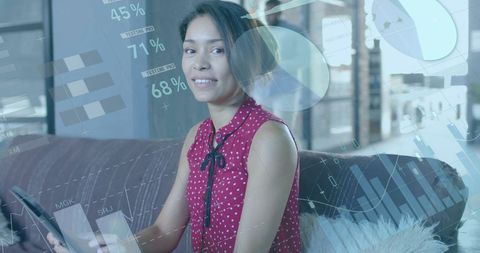 Smiling Businesswoman Analyzing Financial Data Charts
