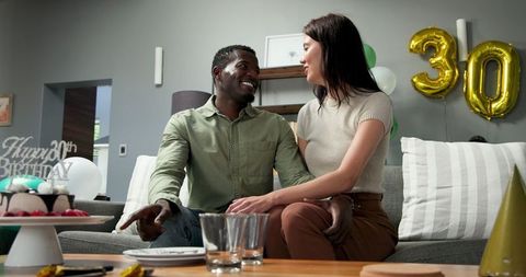 Happy Multiracial Couple Celebrating Birthday Together