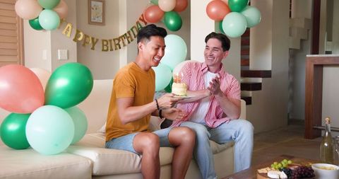 Birthday Celebration with Joyful LGBTQ+ Couple and Cake
