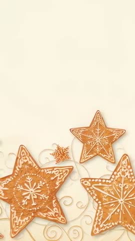 Panning vertical video showing star gingerbread cookies on neutral card for holiday design