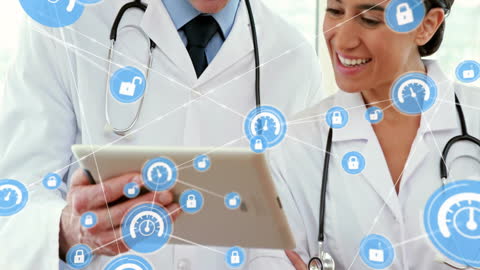 Diverse Medical Professionals Using Tablet with Data Network
