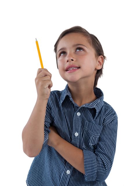 Thoughtful boy standing against white background