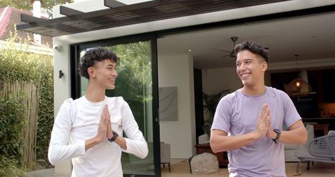 Two Friends Practicing Serenity through Yoga Outdoors
