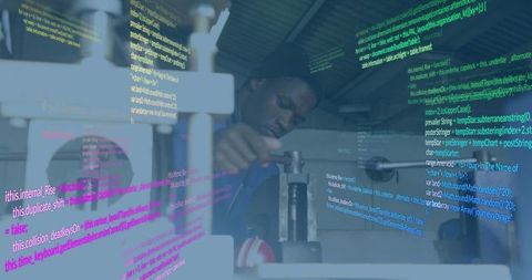 Machinist Operating Metal Press with Digital Code Overlay