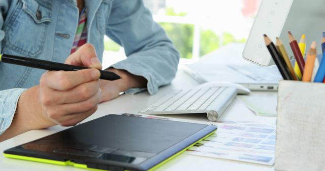 Graphic Designer Working on Tablet at Creative Workspace - Download Free Stock Images Pikwizard.com