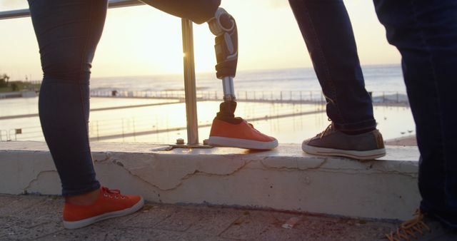 Amputee Person with Prosthetic Leg Standing by Ocean at Sunset - Download Free Stock Images Pikwizard.com