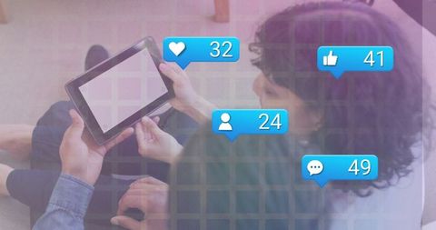 Friends Engaging with Tablet and Social Media Commentary Nearby