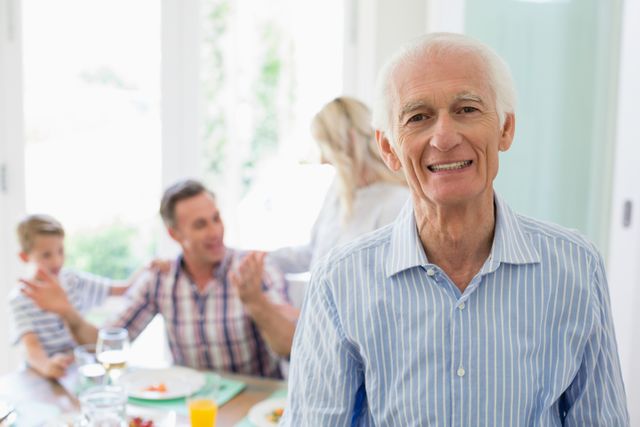 Senior man smiling at home - Download Free Stock Photos Pikwizard.com