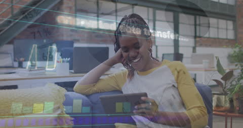 African American Businesswoman Analyzing Digital Data on Tablet