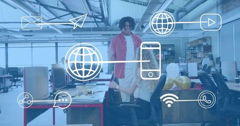 Young Colleagues Celebrating in Modern Open-Plan Office with Digital Connectivity Icons