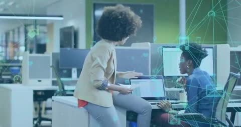 Colleagues Collaborating in High-Tech Office Environment