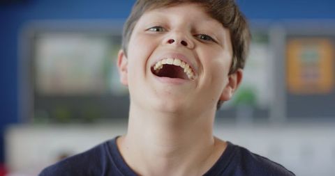 Confident Smiling Boy in Classroom Embracing Learning - Download Free Stock Images Pikwizard.com