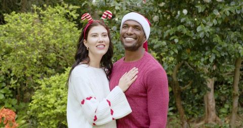 Festive Couple Celebrating in Lush Garden Setting