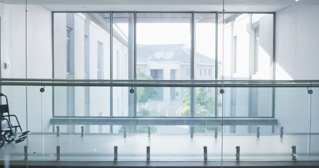 Hospital Corridor with Wheelchair by Glass Barrier and Window - Download Free Stock Images Pikwizard.com