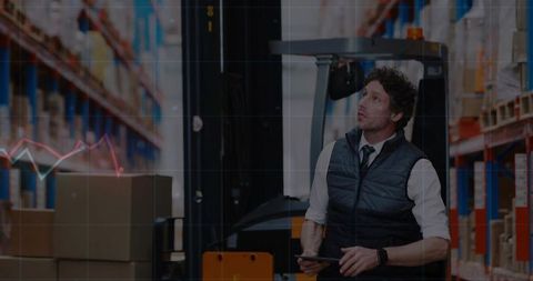 Warehouse Manager Checking Inventory Levels with Tablet