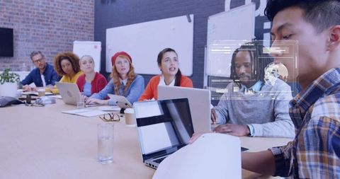 Team Reviewing Documents with Augmented Reality Data Overlay During Boardroom Meeting