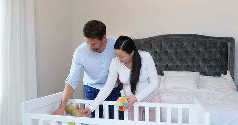 Expectant Parents Preparing Nursery Together with Toys - Download Free Stock Images Pikwizard.com