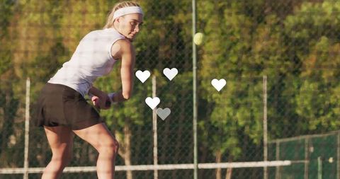 Athletic Tennis Player in Action on Outdoor Court with Sunlight