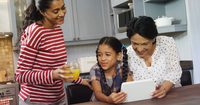 Family Morning Routine with Digital Tablet and Juice in Kitchen - Download Free Stock Images Pikwizard.com