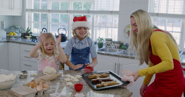 Happy Kids Baking Christmas Cookies with Mother in Home Kitchen - Download Free Stock Images Pikwizard.com