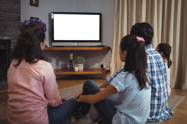 Transparent family watching blank television screen, living room setting - Download Free Stock Videos Pikwizard.com