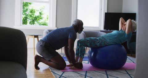 Senior Couple Exercising Together in Modern Living Room - Download Free Stock Images Pikwizard.com