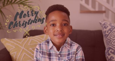 Smiling Boy with Merry Christmas Greeting