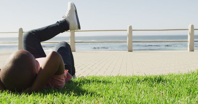 Relaxing on Green Grass Beside Seaside Promenade - Download Free Stock Images Pikwizard.com