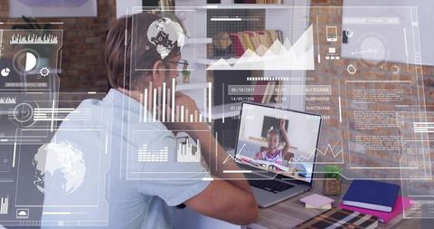 Man watching online tutoring with augmented reality data overlays in home workspace