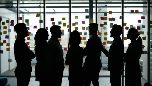 Business team brainstorming in office with sticky notes
