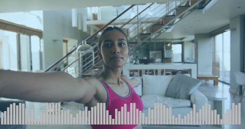 Woman Exercising in Modern Open-Plan Living Space