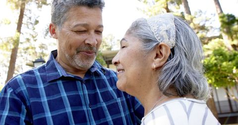 Senior Biracial Couple Dancing Joyfully Outdoors