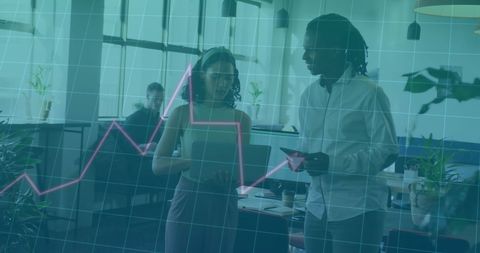 Financial data analysis with diverse colleagues in modern office