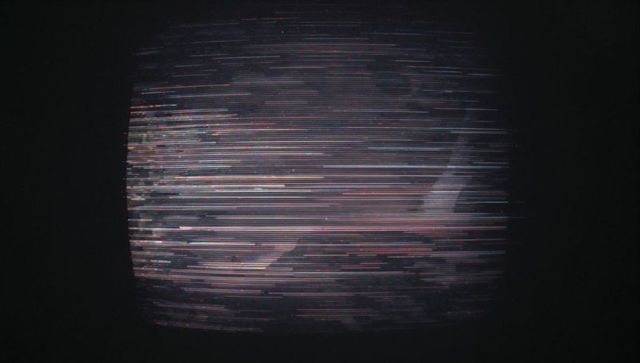 Glitching Television Screen with Flickering Multicolored Static