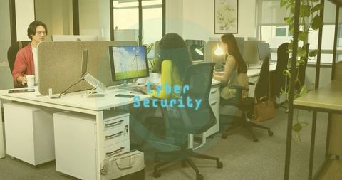 Colleagues Analyzing Cyber Security Threats in Open Office Environment