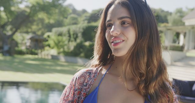 Smiling Young Woman Relaxing Outdoors Near Pool - Download Free Stock Images Pikwizard.com