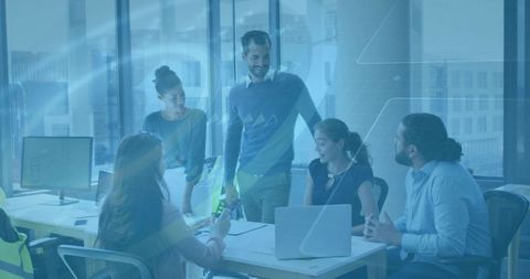 Urban Team Collaborating Around Conference Table with Laptop and City Window View