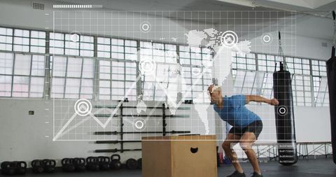 Athlete performing explosive box jump in industrial gym with digital analytics overlay