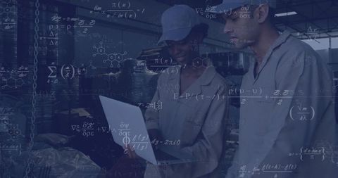 Technicians Analyzing Data on Pharmaceutical Plant Floor