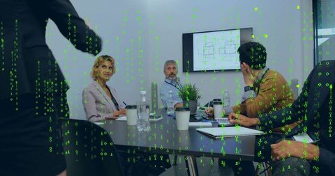Business team reviewing digital floor plan and analyzing cyber risk with matrix overlay