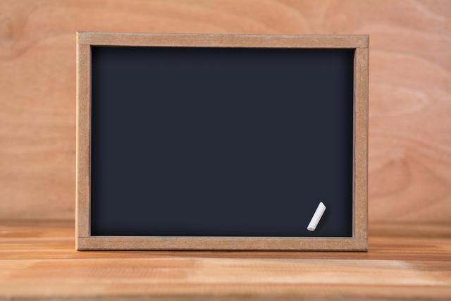 Close-up of blank chalkboard on a table